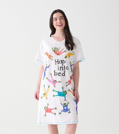 Model wearing white V-neck sleepshirt with colorful frogs and 'Hop into bed' text