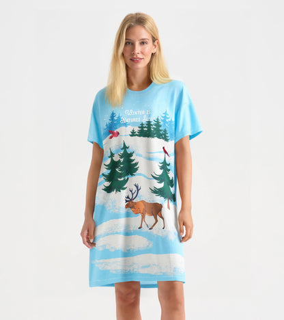 Light blue sleepshirt featuring winter-themed graphics of trees, a moose, and cardinals, with a relaxed fit.