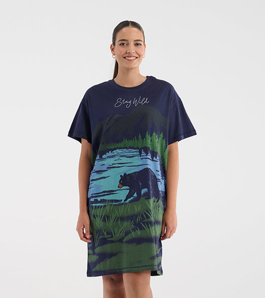 Navy blue sleepshirt featuring a bear and forest scene, with a relaxed fit and short sleeves.