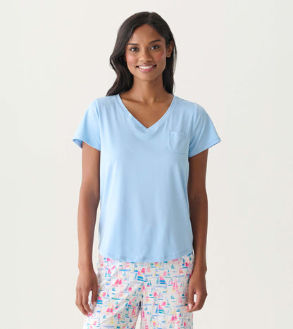 Women's placid blue V-neck T-shirt with short sleeves and a chest pocket, shown on model