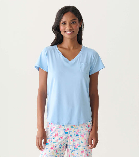 Women's placid blue V-neck T-shirt with short sleeves and a chest pocket, shown on model