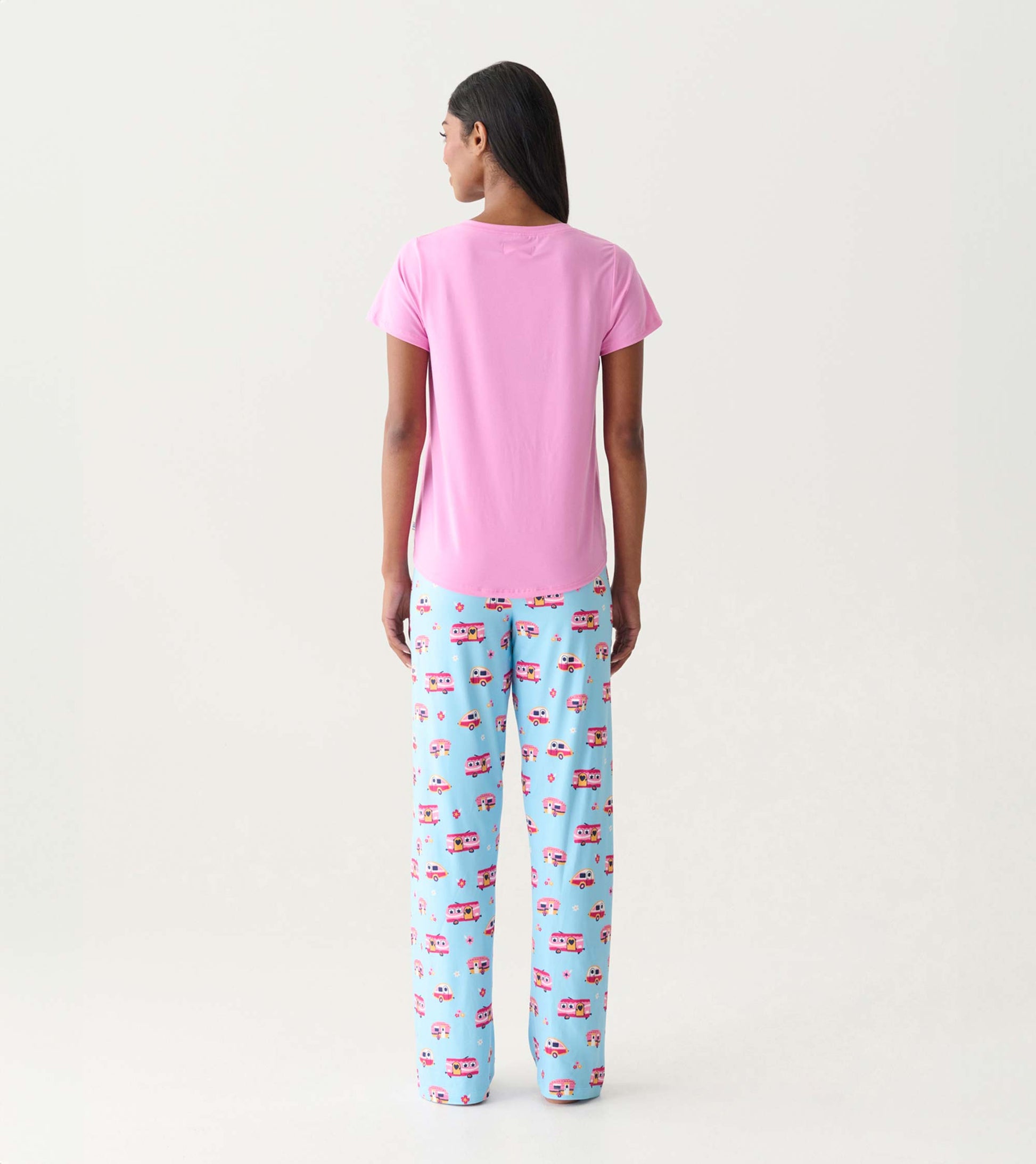 Back view of a pink V-neck T-shirt with short sleeves, paired with blue patterned pajama pants.