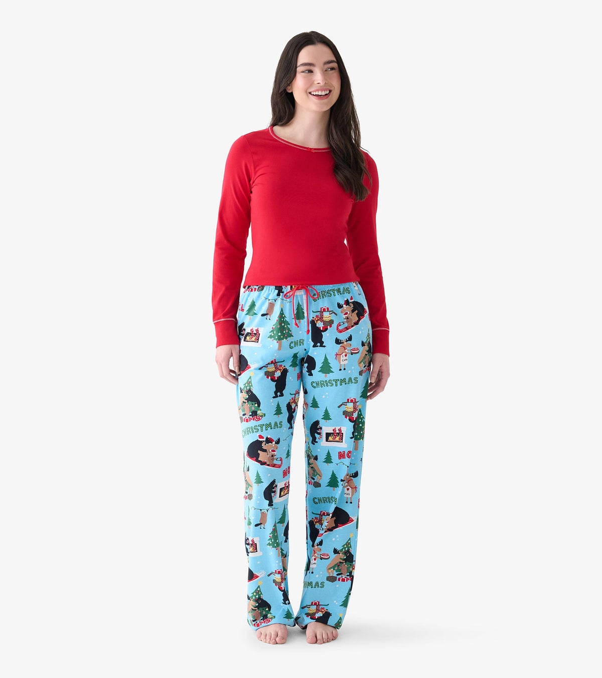Women's red long sleeve pajama top shown from the front on model with blue holiday print pajama pants
