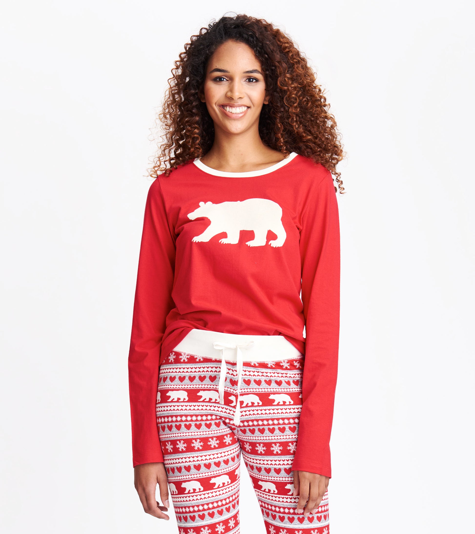 Red long sleeve pajama tee featuring a white bear graphic, paired with patterned red and white pajama pants.