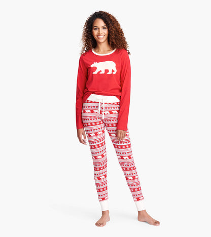 Red long sleeve pajama tee with white bear graphic, paired with patterned red and white pajama pants featuring bears and sno…