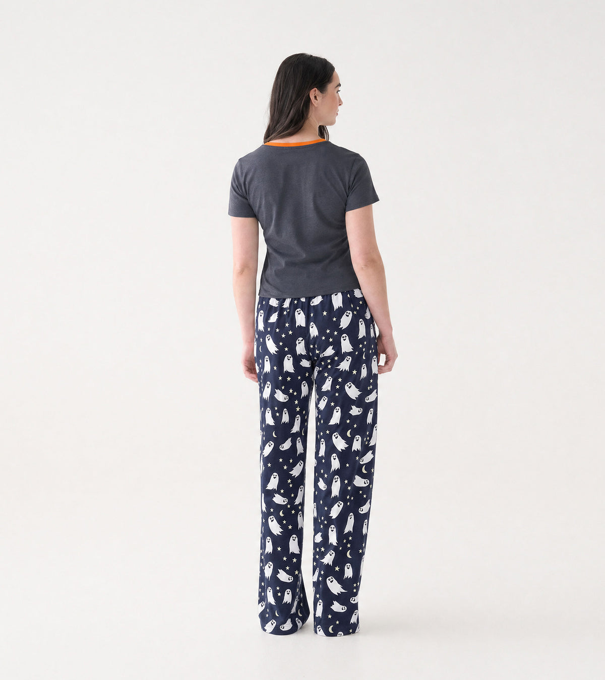Back view of gray pajama T-shirt with orange collar, paired with navy ghost print pajama pants