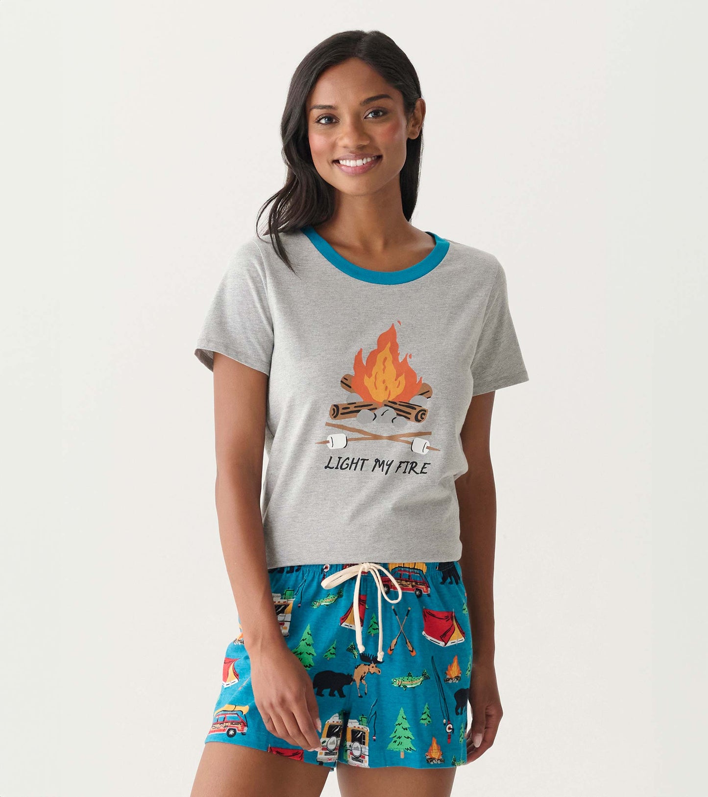 Gray short-sleeve pajama T-shirt with blue trim and campfire graphic, front view on model