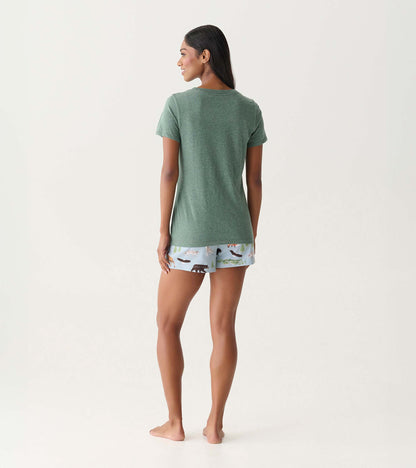 Back view of a green short-sleeve pajama T-shirt with light blue wilderness-print shorts on a model