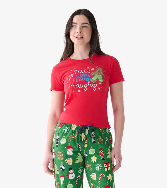 Model wearing red pajama T-shirt with 'Nice Until Proven Naughty' text and gingerbread graphic