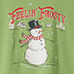 Green shirt with a snowman in a red scarf and hat, candy cane, snowflakes, and the words "Feelin' Frosty