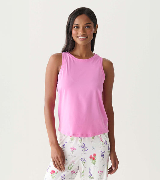Pink sleeveless pajama tank top with a crew neckline, shown front view on a model.