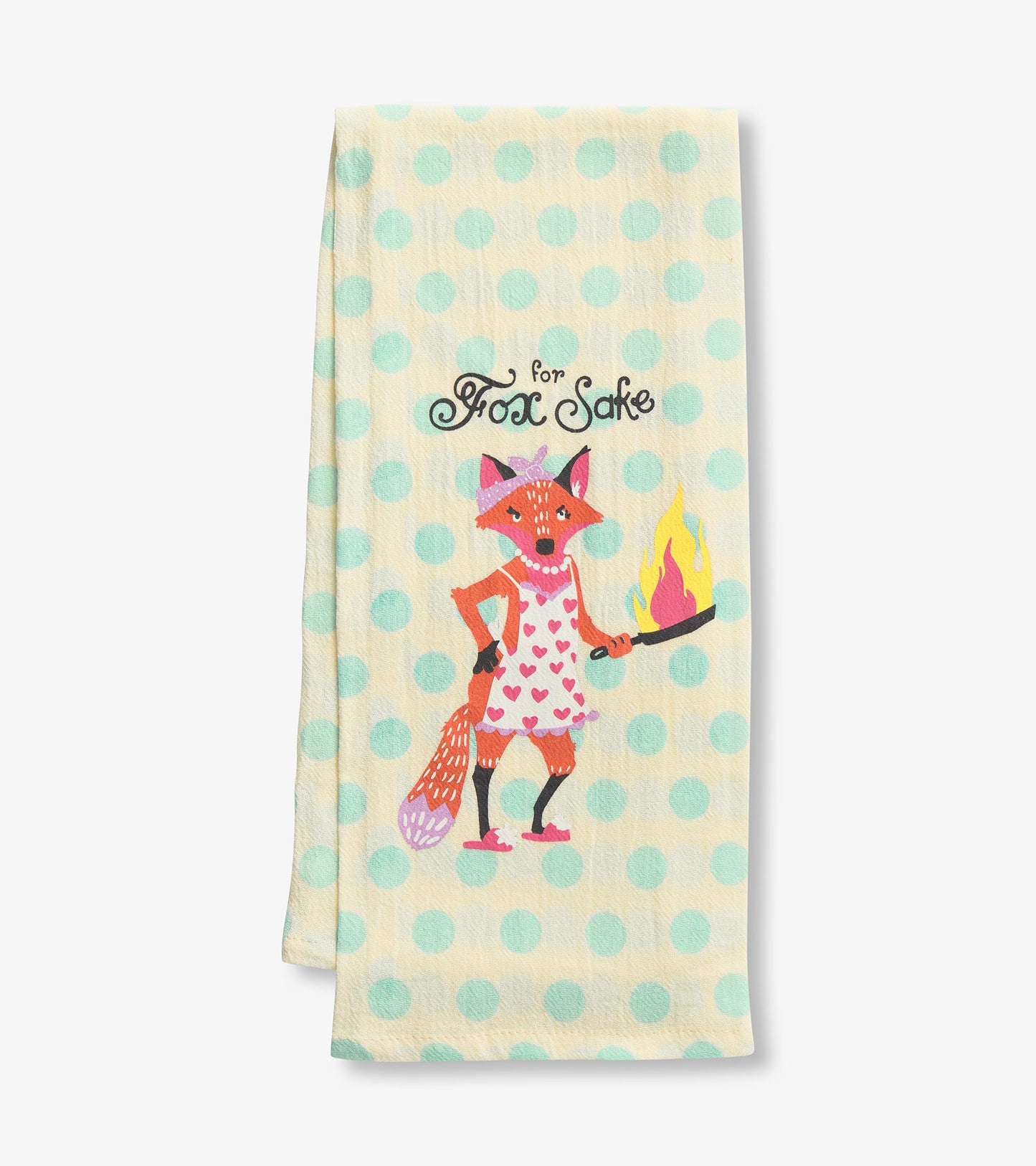 Yellow tea towel with mint polka dots featuring a cartoon fox in an apron holding a flaming pan.