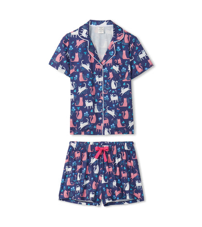 Navy short-sleeve button-down pajama set with cat print and matching shorts with pink drawstring, front view.