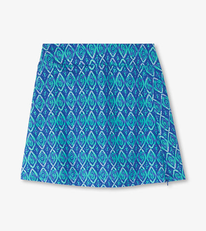Blue skort featuring a diamond pattern in shades of teal and turquoise, designed for casual wear.