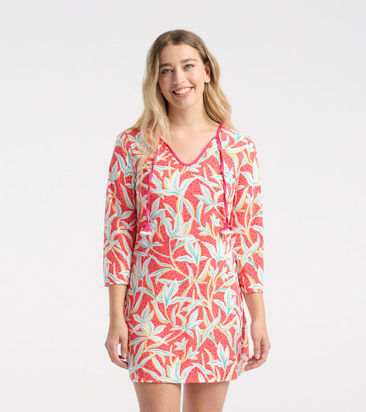 Short-sleeve beach dress featuring a vibrant pink leafy floral pattern, perfect for summer outings.