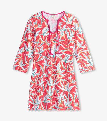Bright pink beach dress featuring a leafy floral pattern and a V-neck with drawstring, ideal for summer wear.