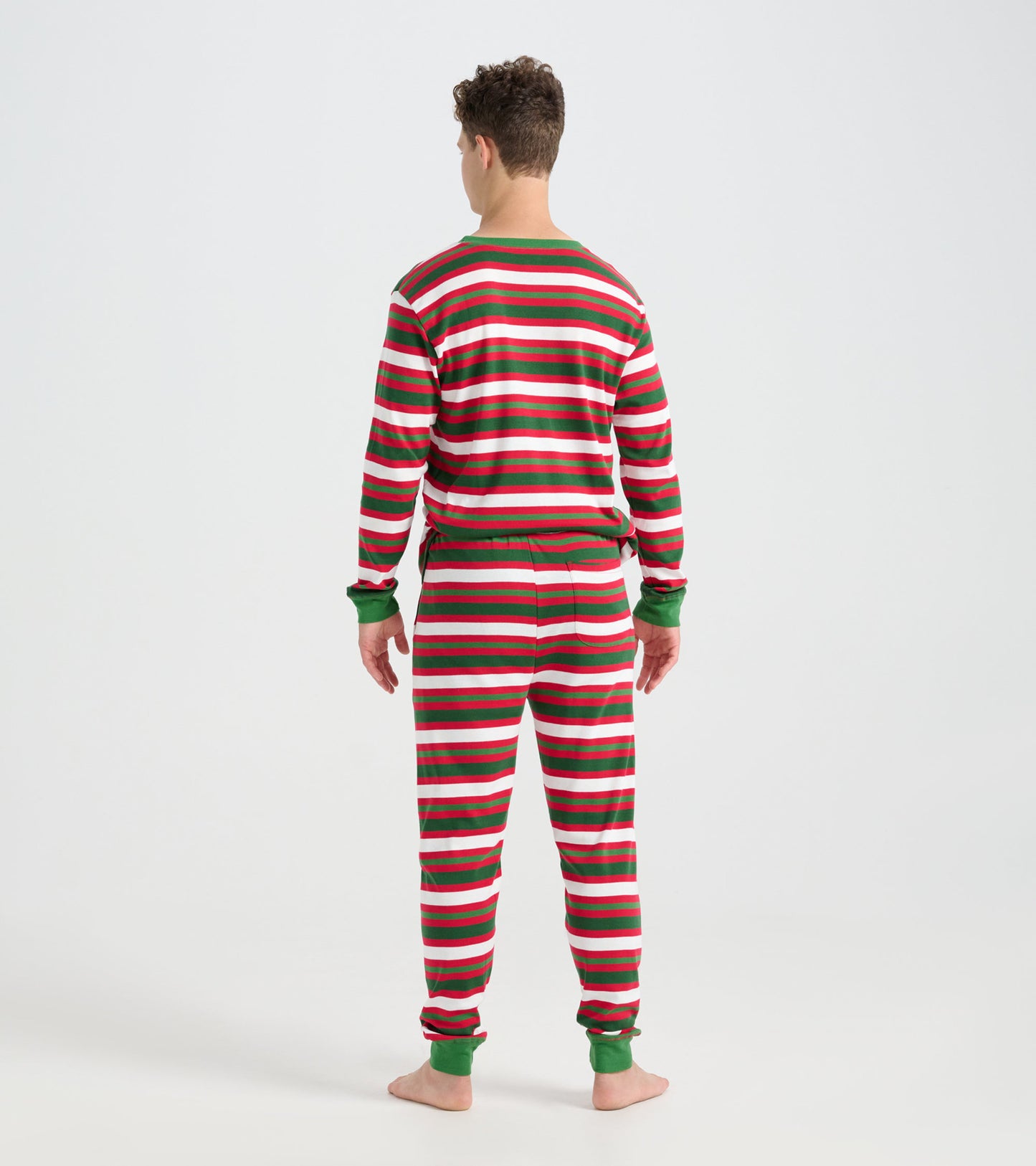 Men's pajama set featuring a candy cane stripe pattern in red, green, and white, shown from the back.