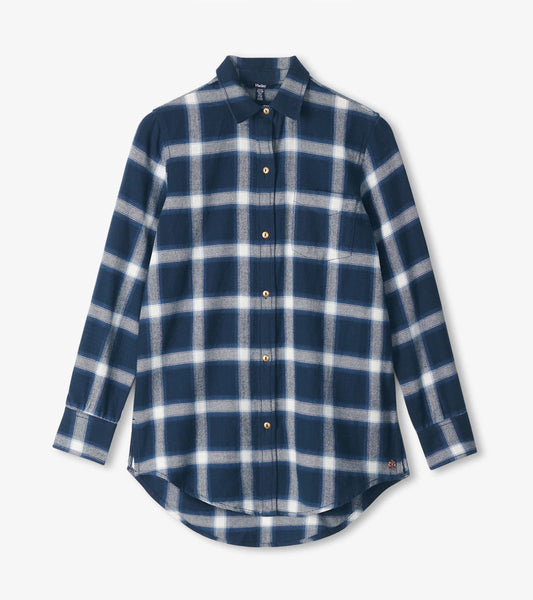 Navy tunic with a wide white windowpane pattern, long sleeves, button-up front, and a curved hem.