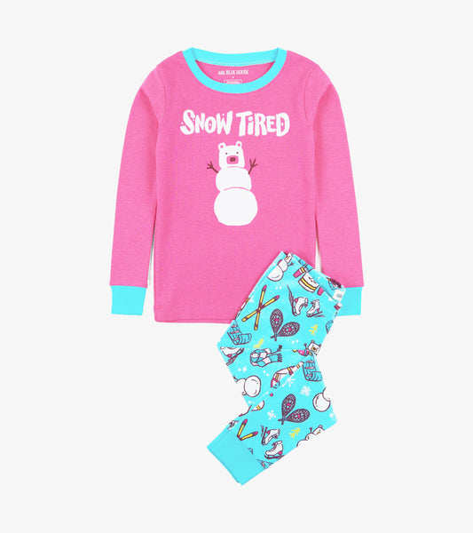 Pink long-sleeve top with "Snow Tired" graphic and blue-accented cuffs, paired with turquoise pajama pants featuring winter…