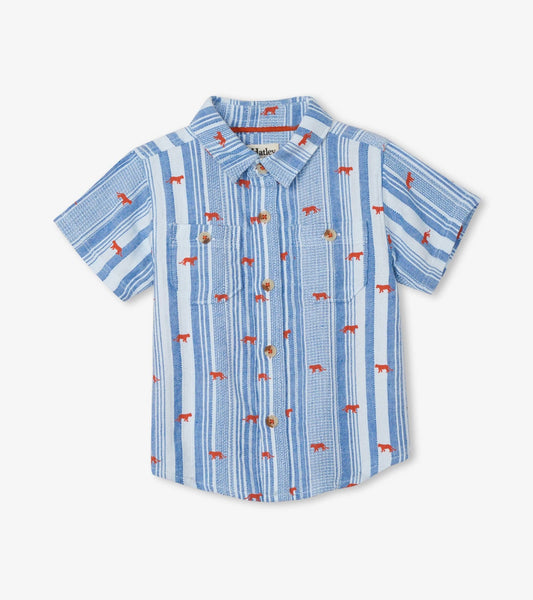 Light blue short-sleeve button-down shirt with red jungle cat prints and vertical stripes. Features two front pockets.