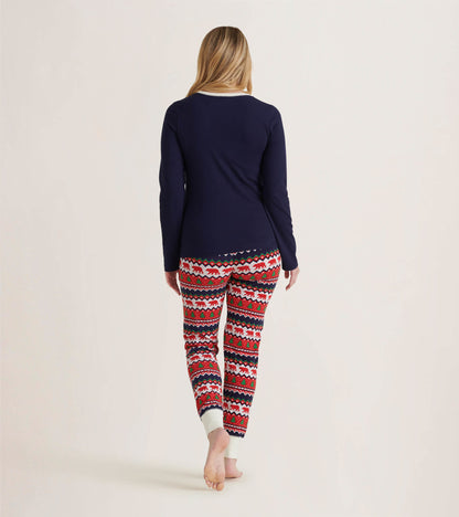 Navy long sleeve pajama top paired with festive red and white patterned pants featuring polar bears and hearts.