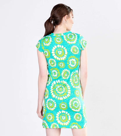 Short-sleeve dress featuring a vibrant turquoise fabric with a painted mandala pattern in green and white. Back view.