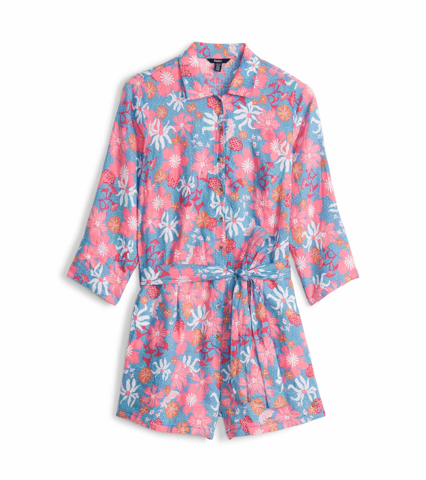 Colorful floral romper featuring a collared neckline, button front, and tie waist, with three-quarter sleeves.