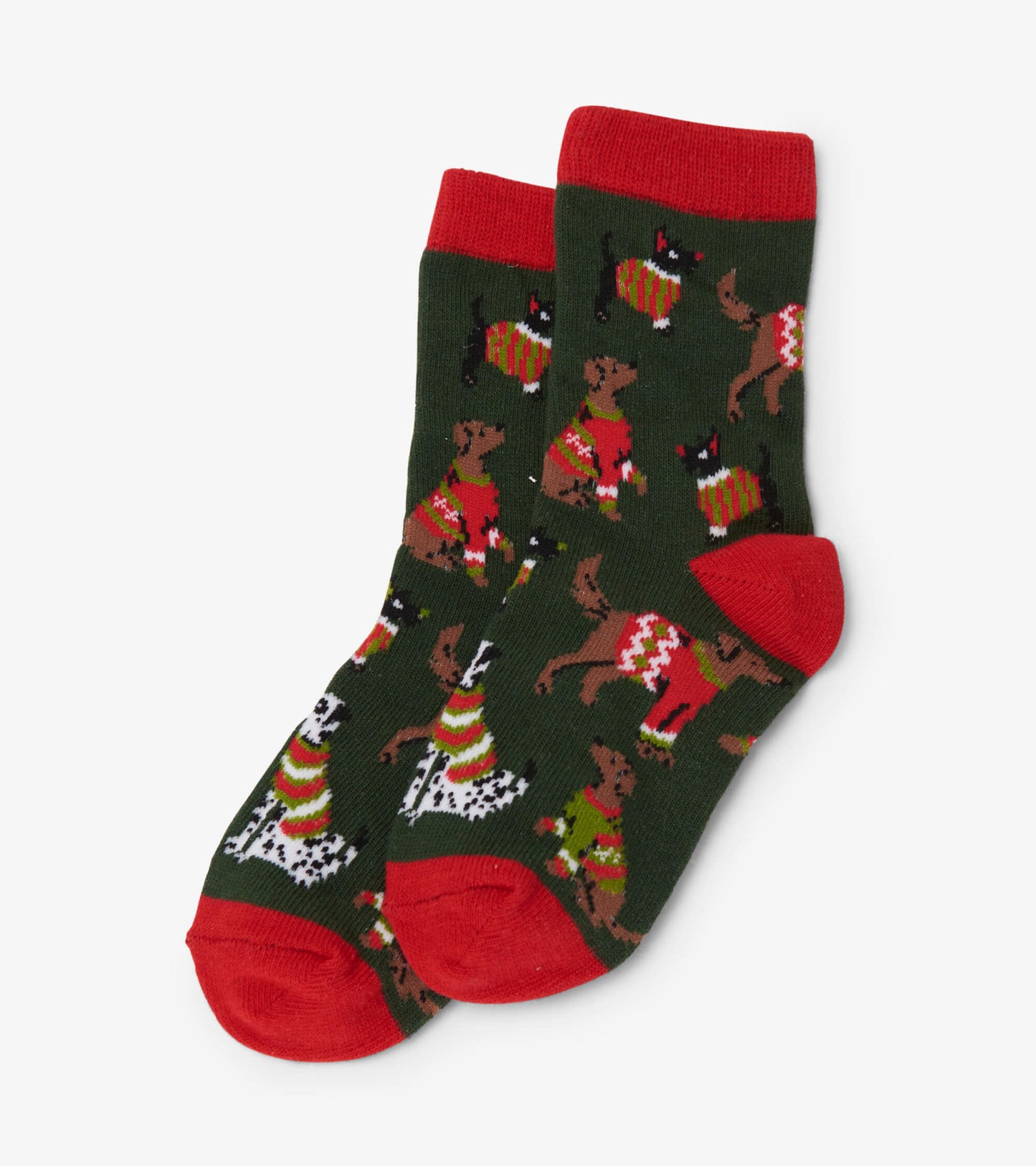 Green crew socks featuring playful dogs in festive sweaters, with red cuffs and toes. Suitable for kids ages 2-7.