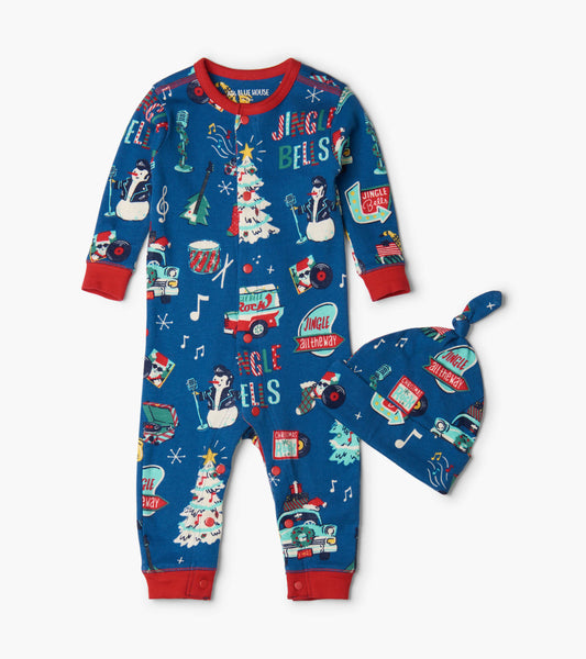 Blue holiday-themed coverall with red accents and matching hat, featuring festive prints of snowmen, trees, and musical note…