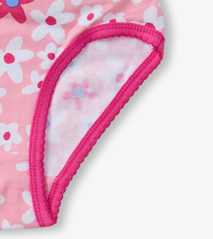 Pink girls' brief underwear featuring a floral pattern and contrasting pink trim.