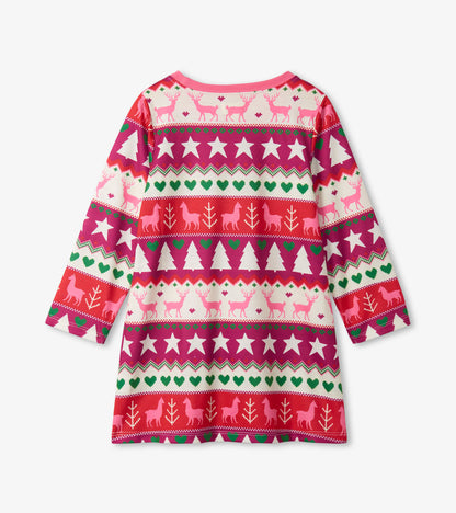 Long sleeve girls nightgown featuring a colorful Fair Isle pattern with reindeer, trees, and stars on a pink background.