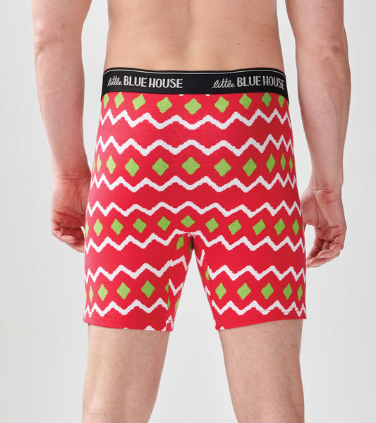 Red boxer briefs featuring a zigzag pattern in white and green, with a black waistband. View from the back.
