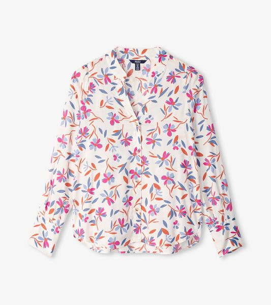 Long-sleeve blouse featuring a deconstructed floral pattern in pink, purple, and orange on a white background.