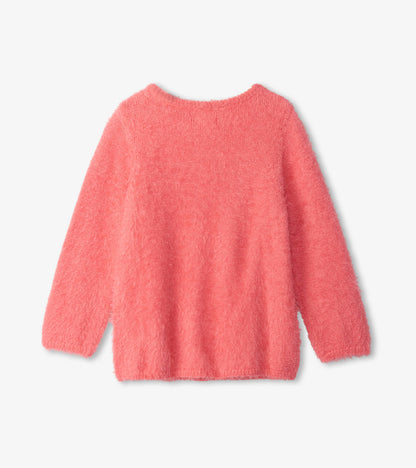 Fuzzy sweater in bright pink with long sleeves and a round neckline, shown from the back.