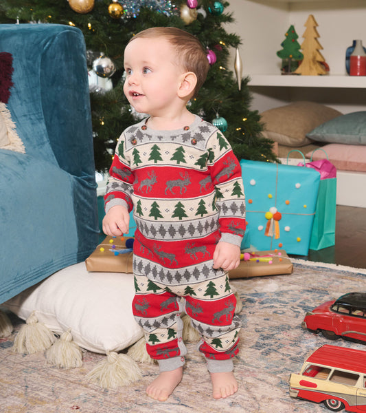 Red and gray Fair Isle baby romper featuring elk and tree patterns, with buttons on the shoulder and cuffs.