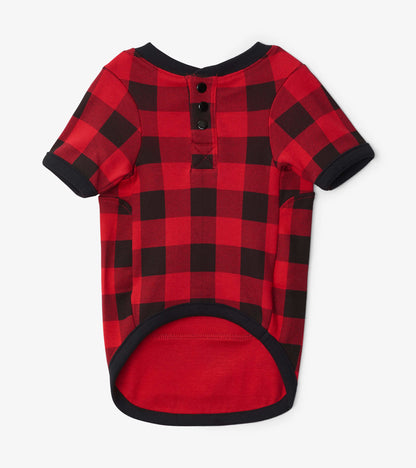 Red and black plaid dog tee with short sleeves and a buttoned back, made from soft fabric.