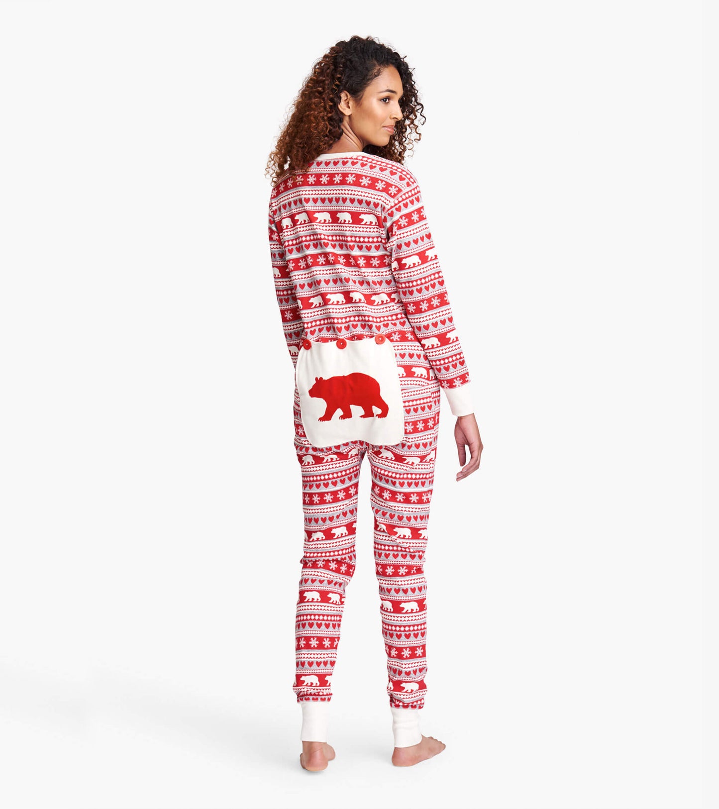 Red Fair Isle patterned adult onesie with a white bear design on the back and ribbed cuffs.