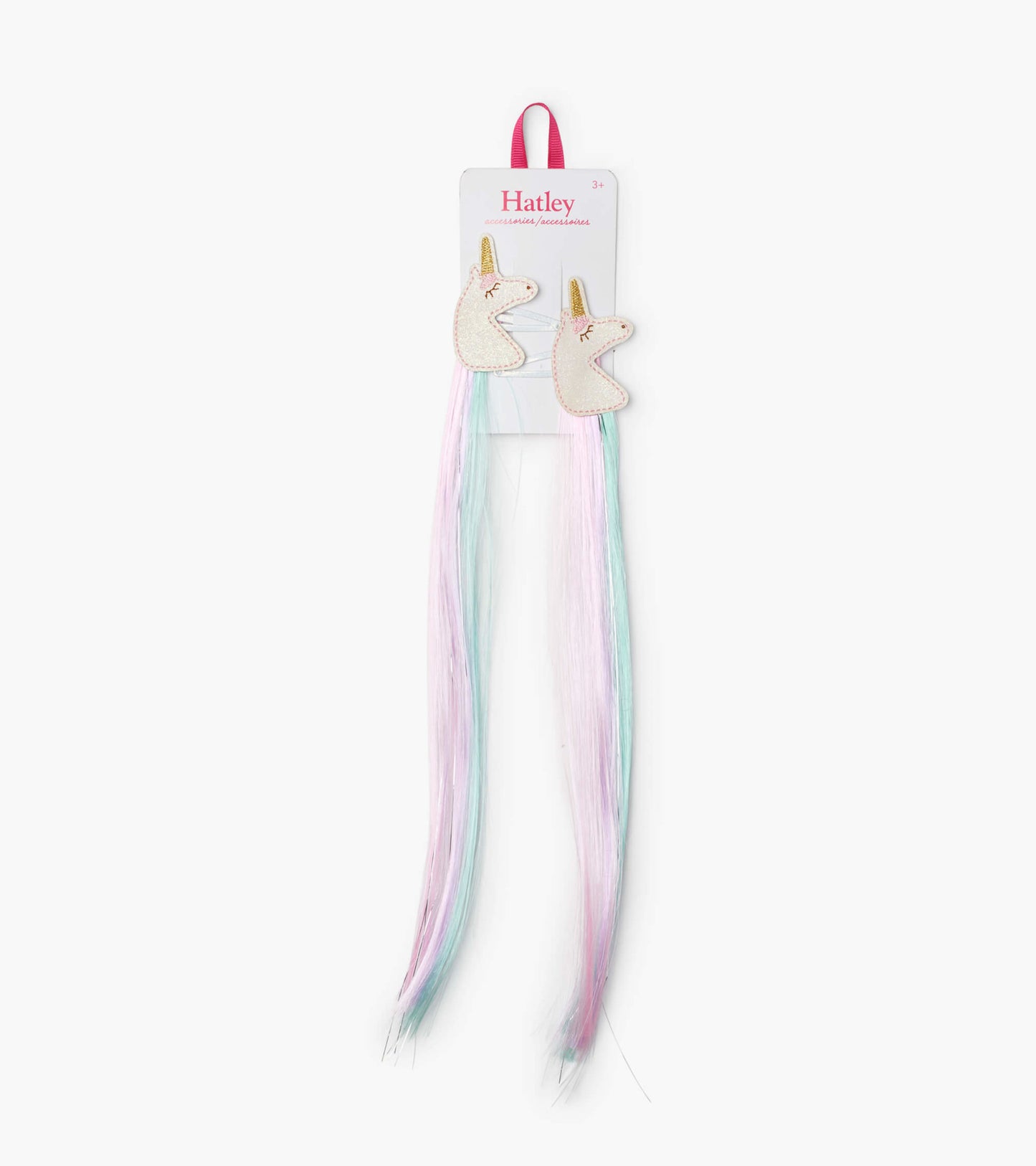 Two unicorn-shaped hair clips with pastel pink and blue faux hair extensions. Ideal for playful hairstyles.