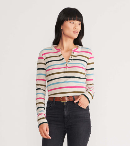 Long-sleeve henley top featuring multicolored stripes on a light background, with a buttoned neckline and fitted silhouette.