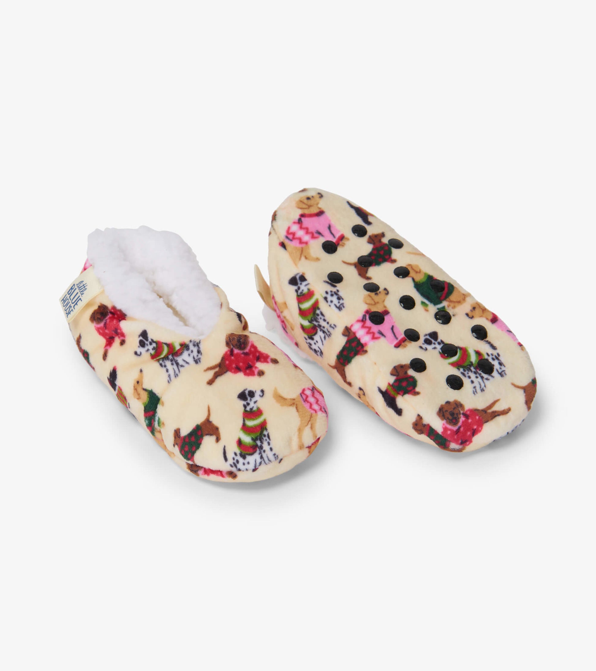 Cozy slippers featuring a playful dog print on a soft, cream background with a fluffy lining and non-slip soles.