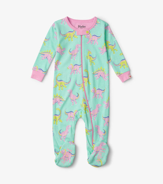Footed sleeper in mint green with colorful dinosaur prints, featuring pink cuffs and a front zipper for easy dressing.