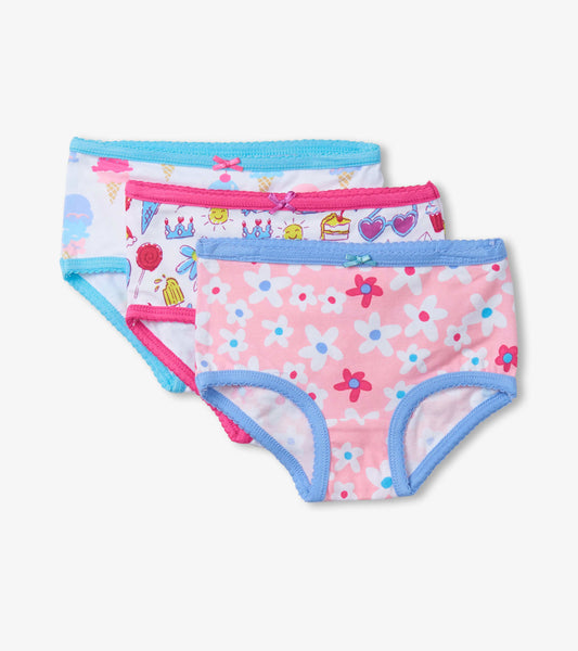 Three pairs of girls' hipster underwear featuring colorful summer prints: ice cream, flowers, and playful icons with contras…
