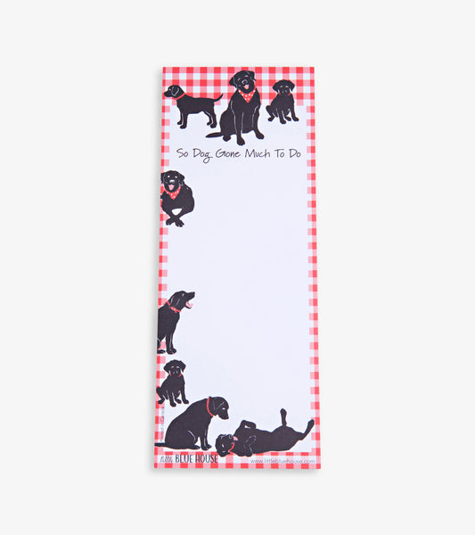 Magnetic notepad featuring black dogs on a red gingham border, ideal for jotting down notes and reminders.