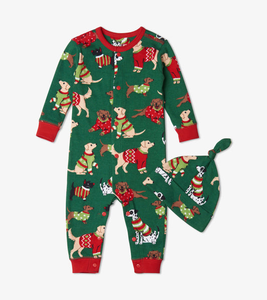 Green Christmas sleeper with dog patterns and red accents, paired with a matching hat. Suitable for babies 3-24 months.