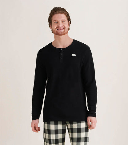 Black long-sleeve waffle henley with three buttons and a bear logo, paired with checkered pants.