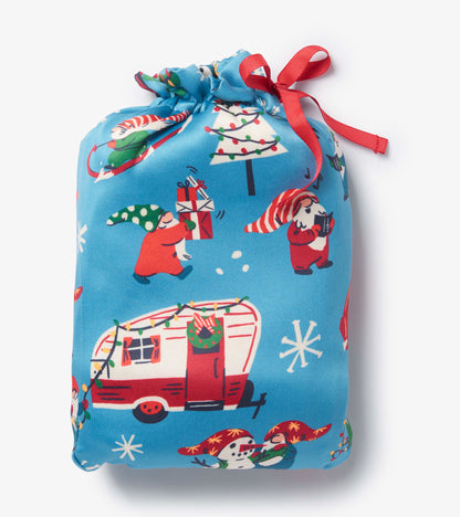 Colorful blue reusable gift bag featuring festive gnomes, snowmen, and a decorated camper, tied with a red ribbon.