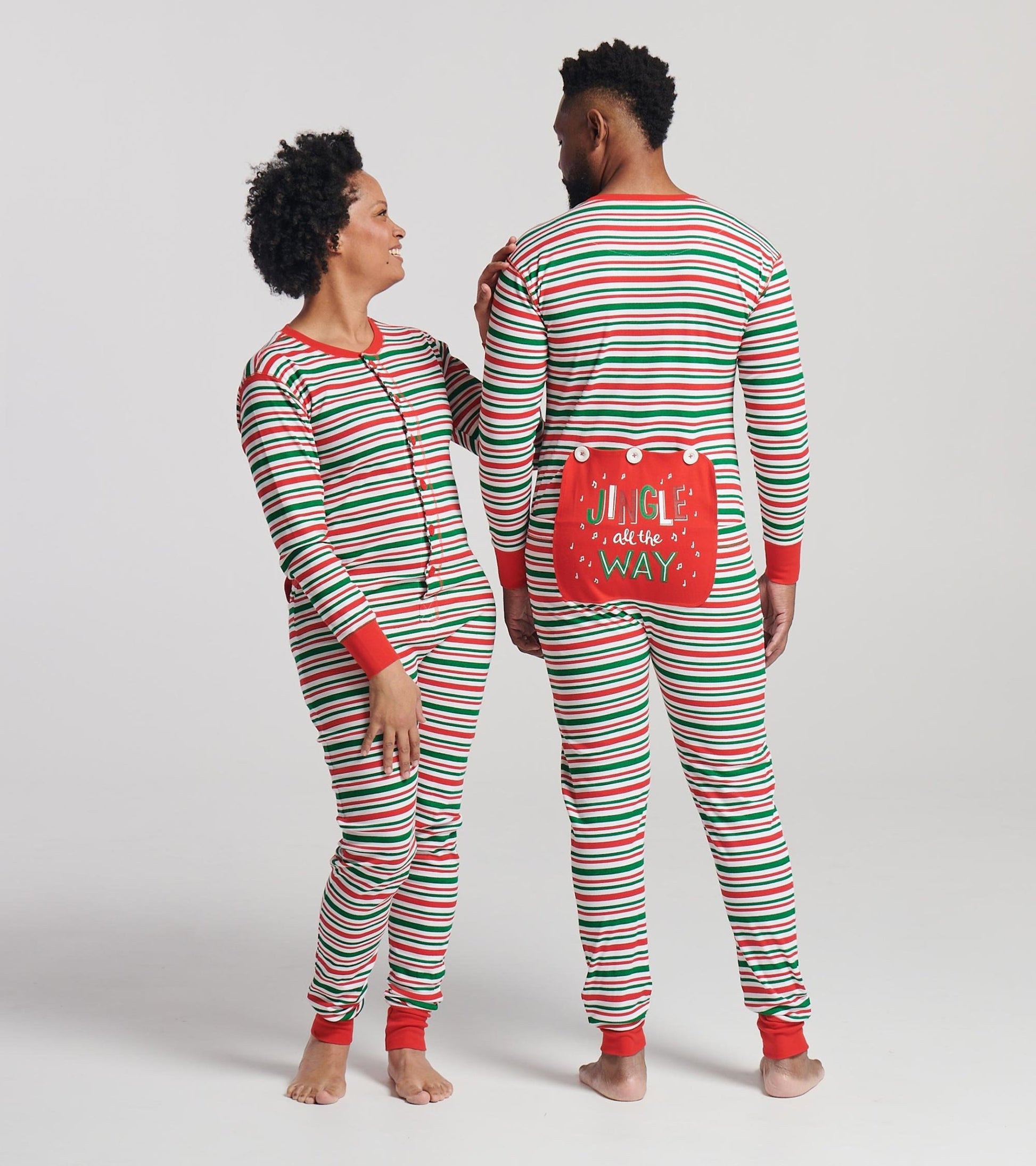 Red and green striped adult onesie with buttons and a festive "JINGLE all the WAY" design on the back.