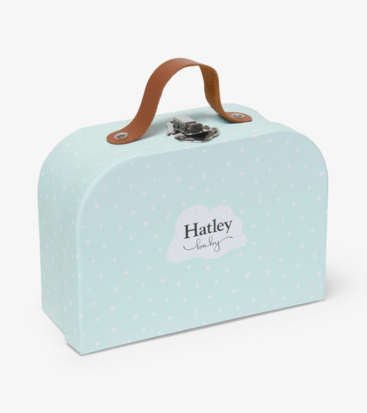 Light blue keepsake box with white polka dots and a brown leather handle, ideal for storing newborn memories.