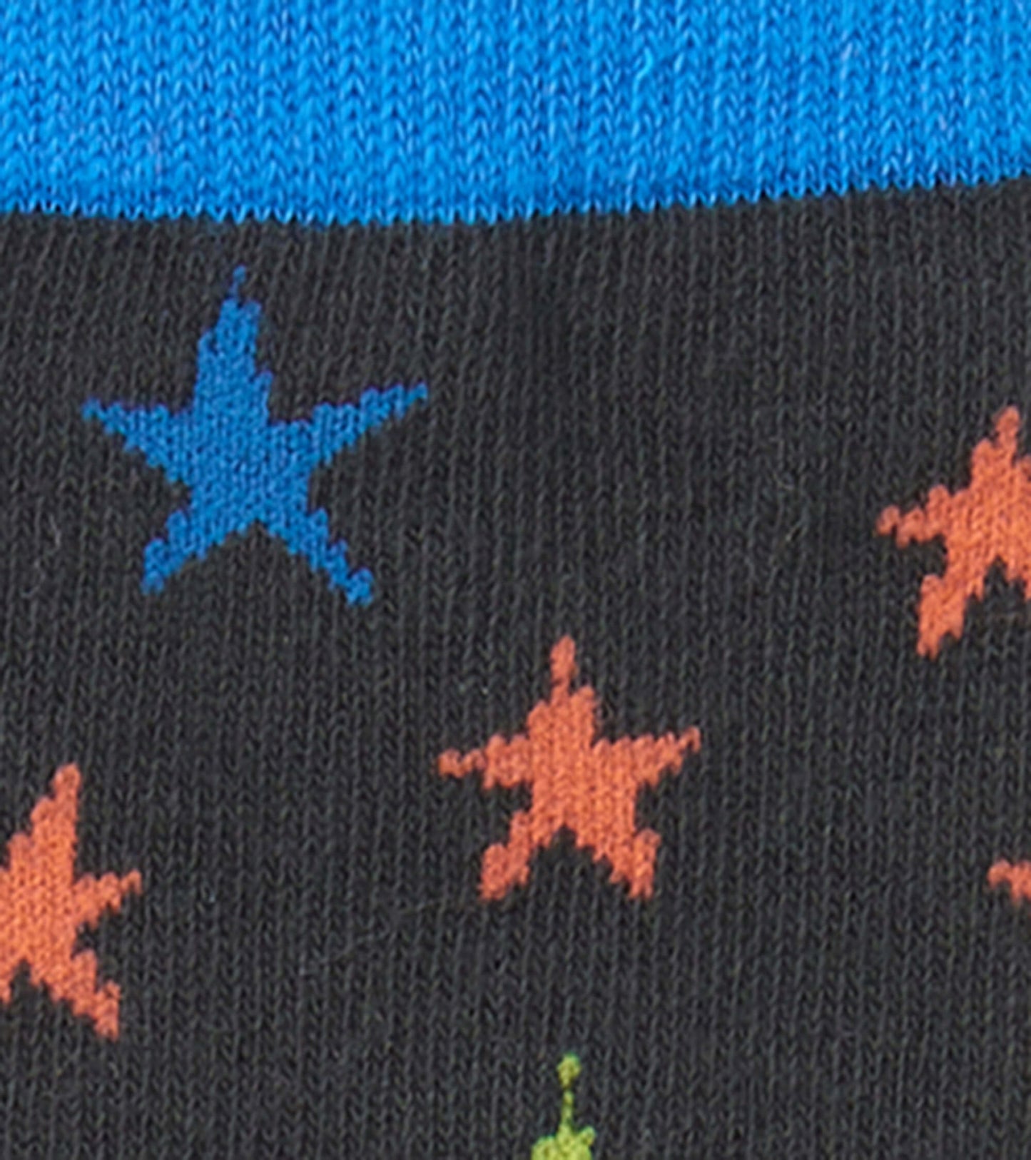 Black crew socks featuring colorful ombre stars in blue, orange, and green, with a blue ribbed cuff.