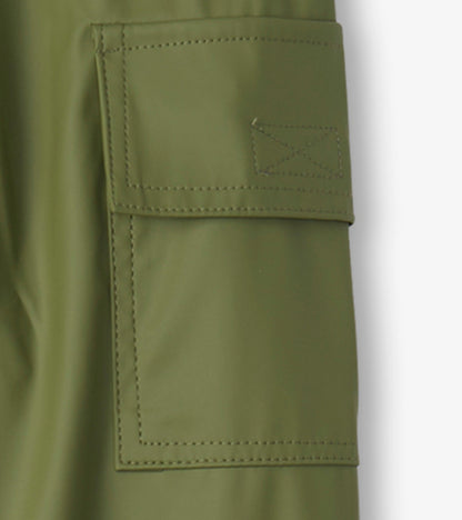 Forest green waterproof kids' rain pants with a side pocket and stitched detailing. Ideal for outdoor play in wet weather.